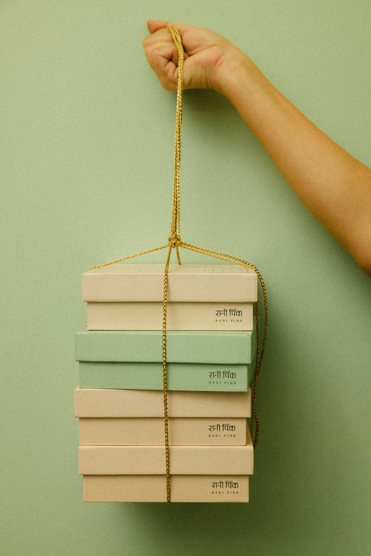Our old-fashioned square mithai boxes come in the prettiest shades of powder pink and pista green, adorned with tiny embossed silver dots and delicate gold Mughal stars.

Thoughtfully designed for kaju katli, motichoor laddoos, and other Indian sweets, these traditional sweet boxes bring a little extra charm to festive gifting, weddings, intimate celebrations, and thoughtful gestures.

Beautifully wrapped treats, made for little celebrations and the pleasure of sending something sweet to someone you love.