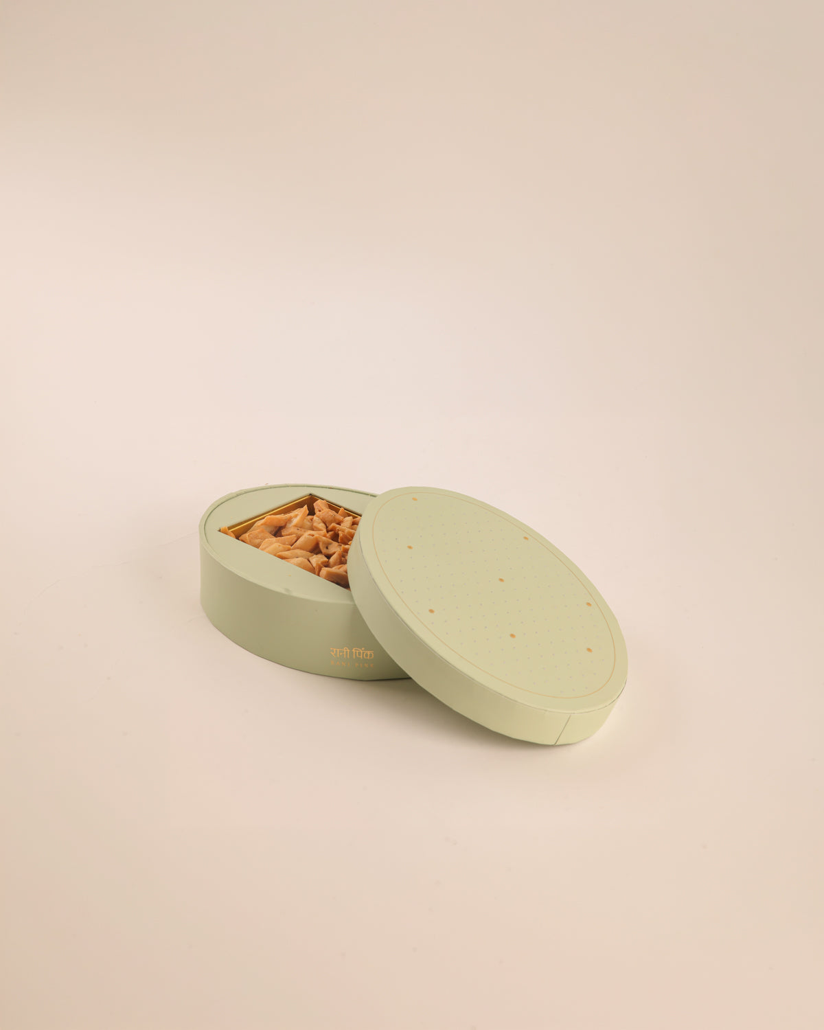 Our old-fashioned square mithai boxes come in the prettiest shades of powder pink and pista green, adorned with tiny embossed silver dots and delicate gold Mughal stars.

Thoughtfully designed for kaju katli, motichoor laddoos, and other Indian sweets, these traditional sweet boxes bring a little extra charm to festive gifting, weddings, intimate celebrations, and thoughtful gestures.

Beautifully wrapped treats, made for little celebrations and the pleasure of sending something sweet to someone you love.