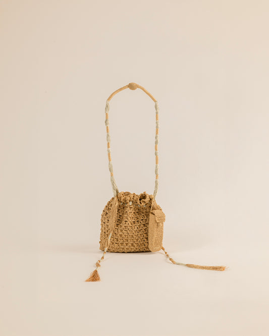 Discover Shop Rani Pink's handcrafted zari crochet potli with a matching lipstick case, adorned with delicate hand-stitched flowers and jewel beads. Perfect for festive occasions.
